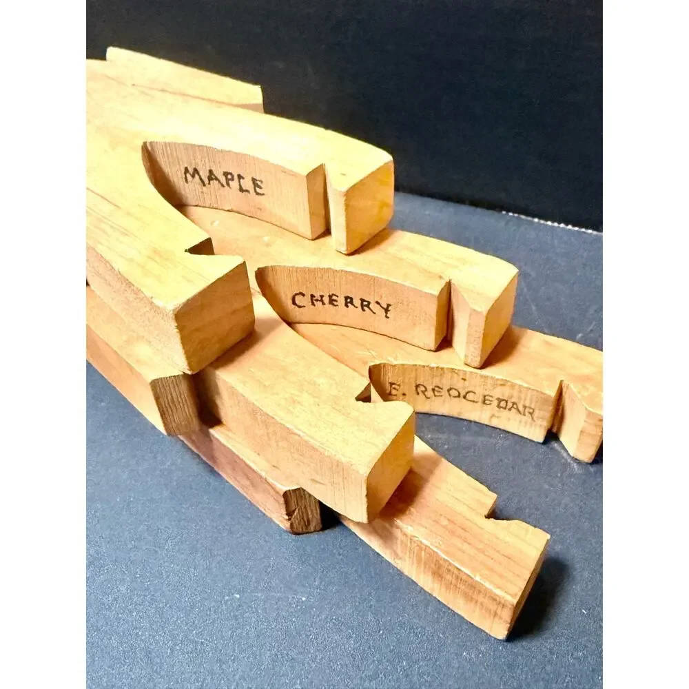 Wooden Stacking Dudes interlocking human shaped made of multiple woods